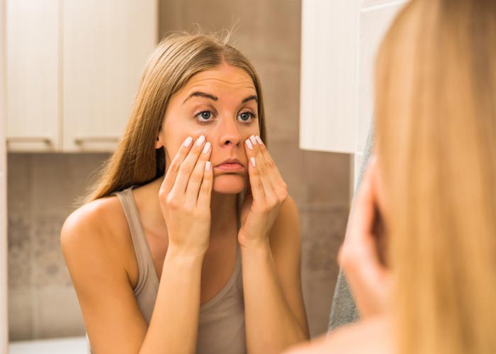 Why do I wake up with puffy eyes in the morning?